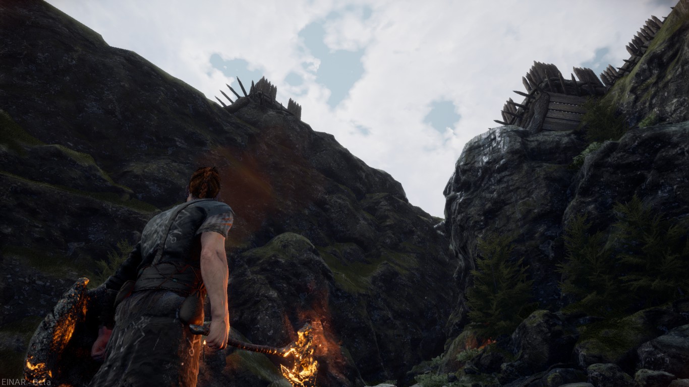 screenshot of Einar looking up to a cliffside with fortifications